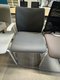 Chaise visiteur structure chromée assise et dossier revêtement PVC gris